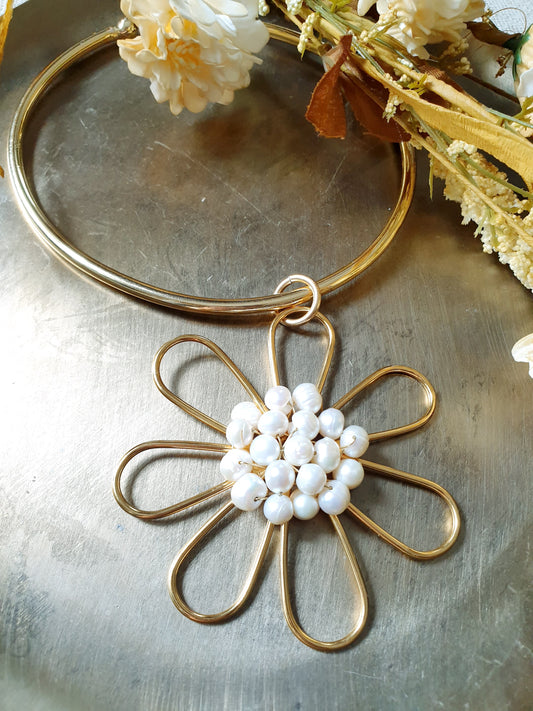 Gold plated flower choker with river pearls.