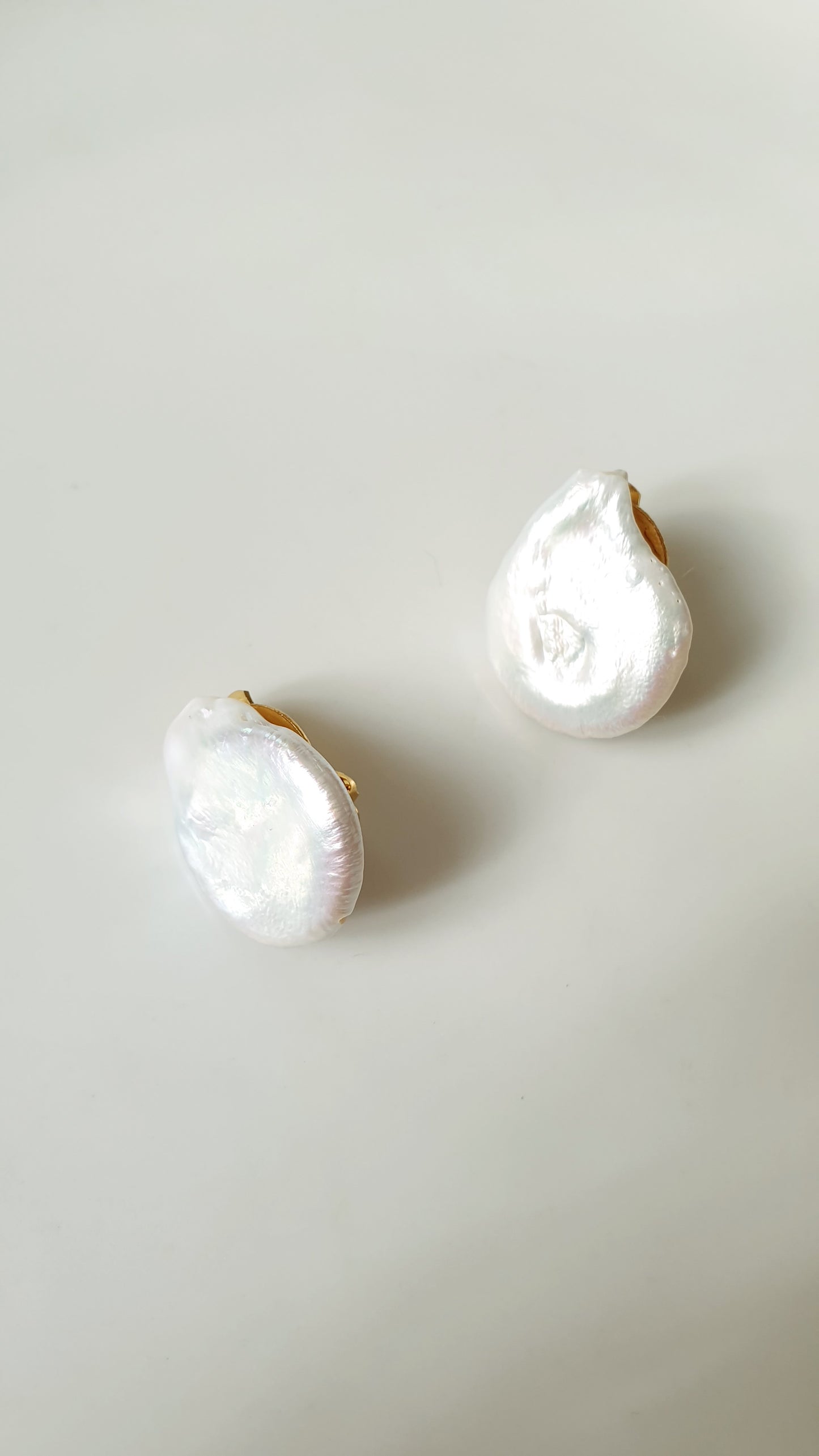 Clip on earrings with pearls