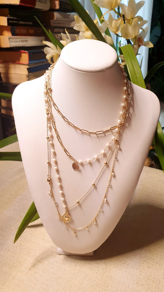 Very long metal necklace with charms.