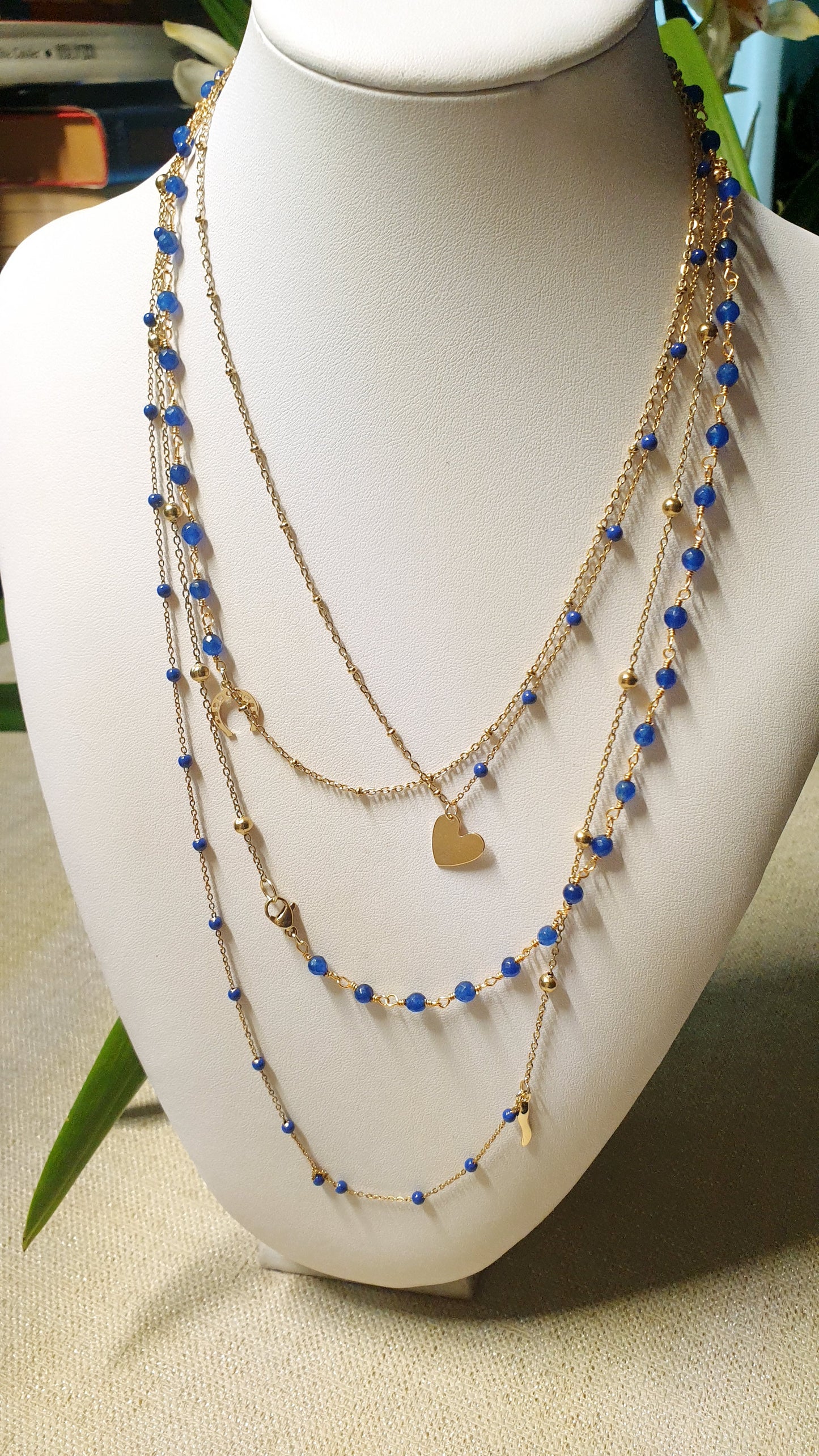 Very long metal necklace with charms.