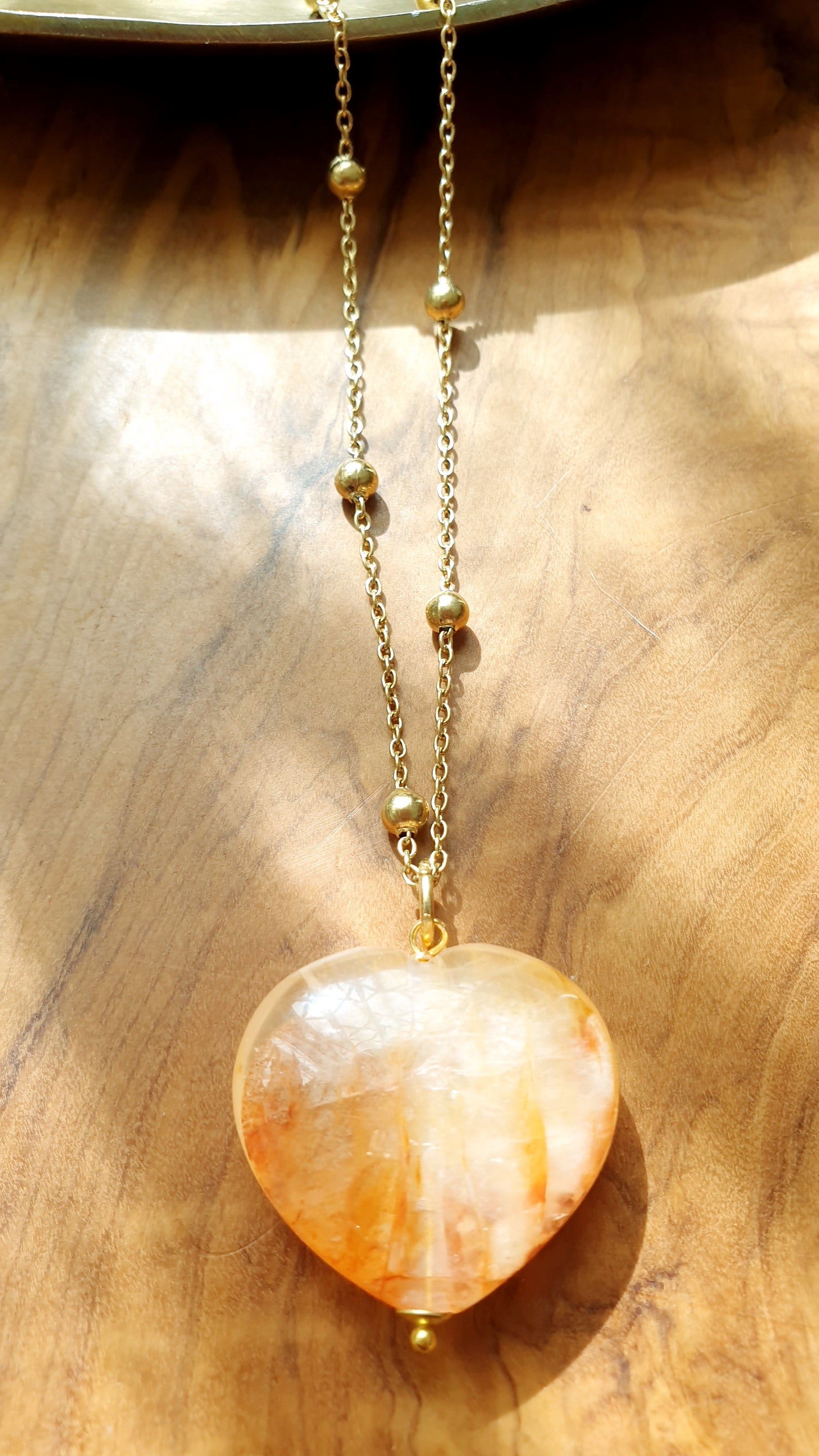 Collana in acciaio con cuore di quarzo