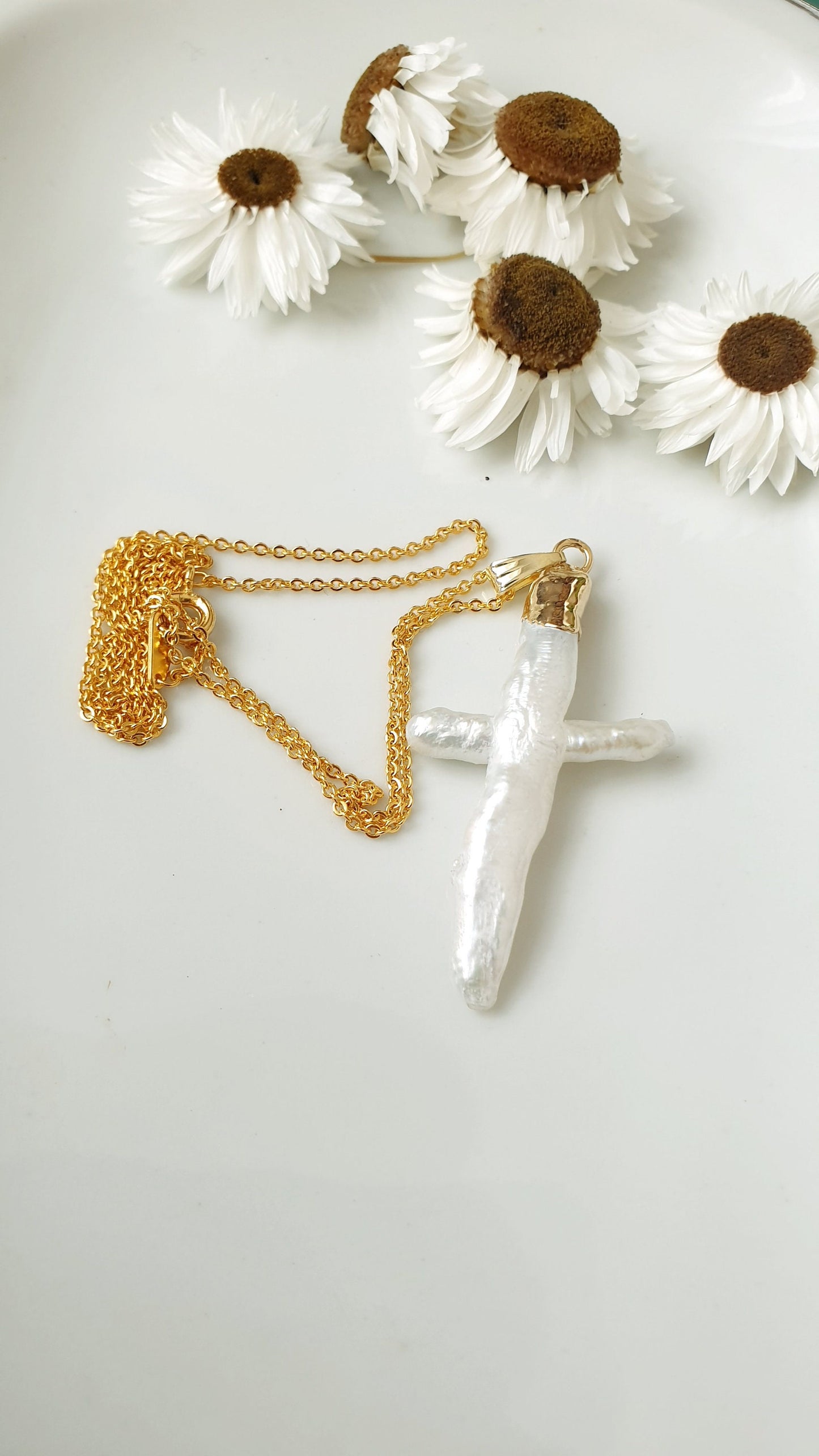 Gold plated choker with mother of pearl cross.