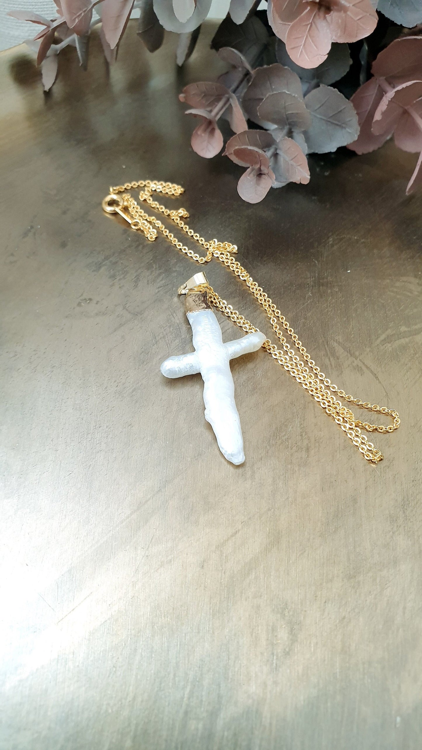 Gold plated choker with mother of pearl cross.