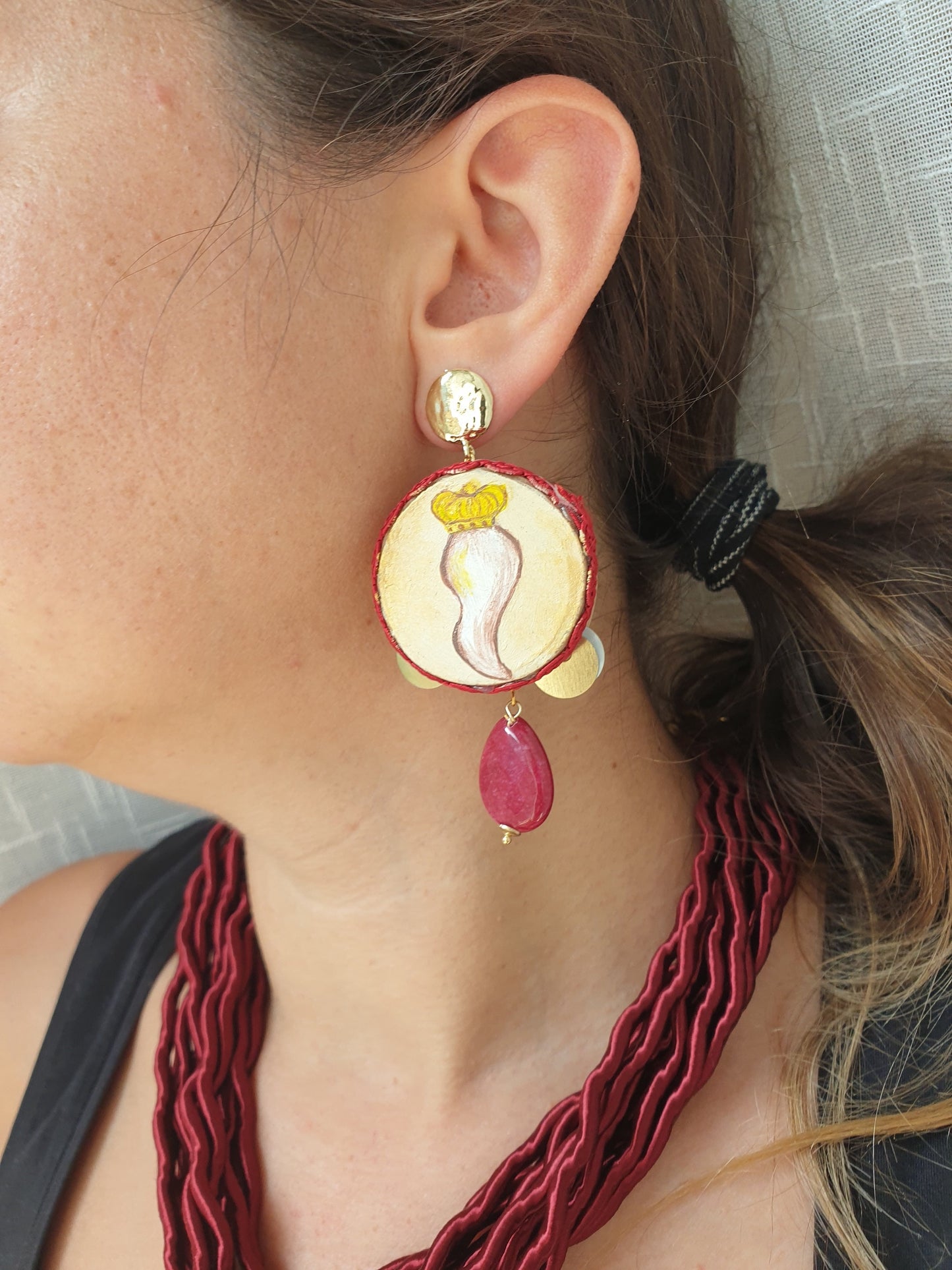 Tambourine earrings with real stones.