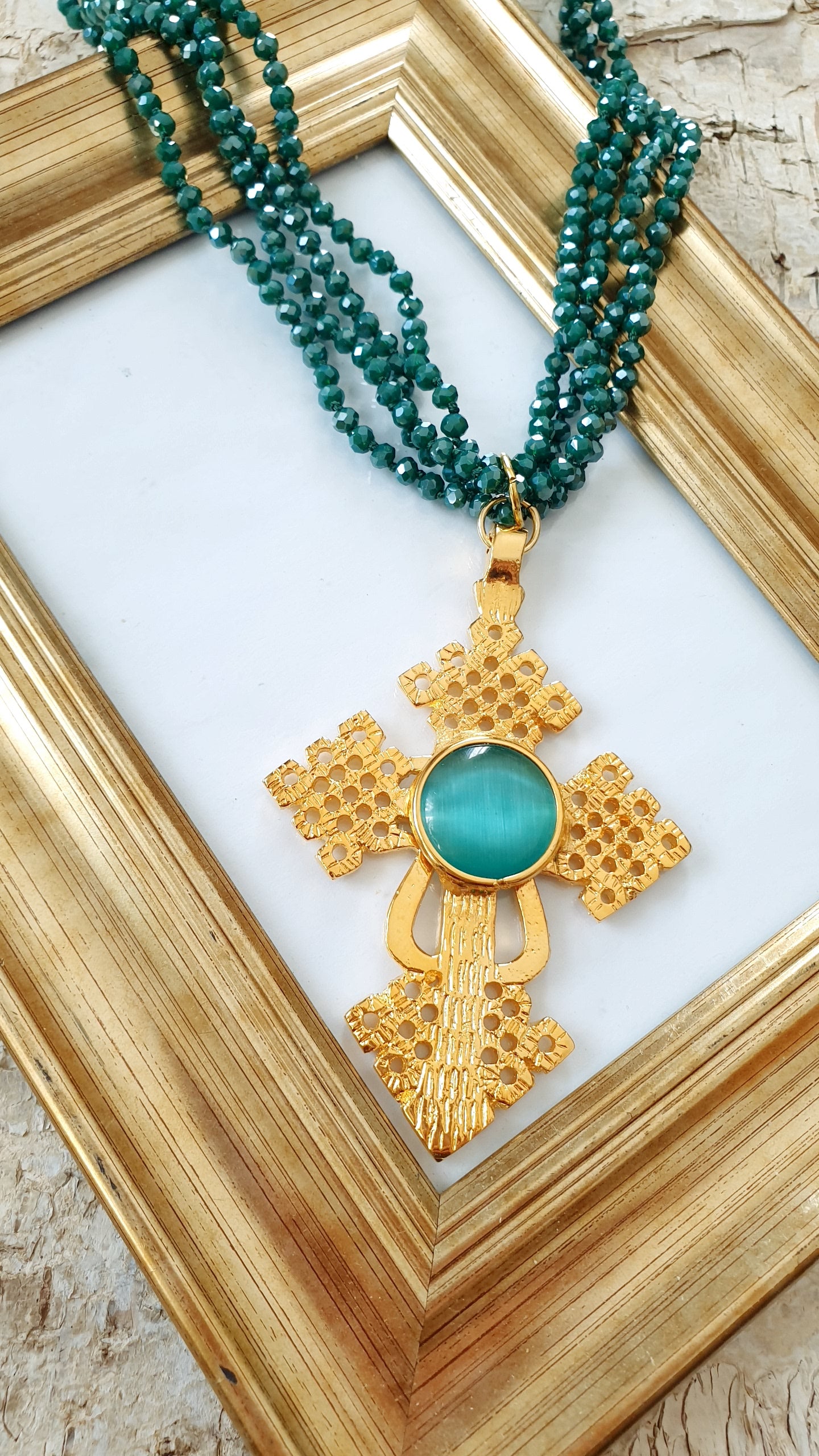 Girocollo di cristallini con croce e occhio di gatto