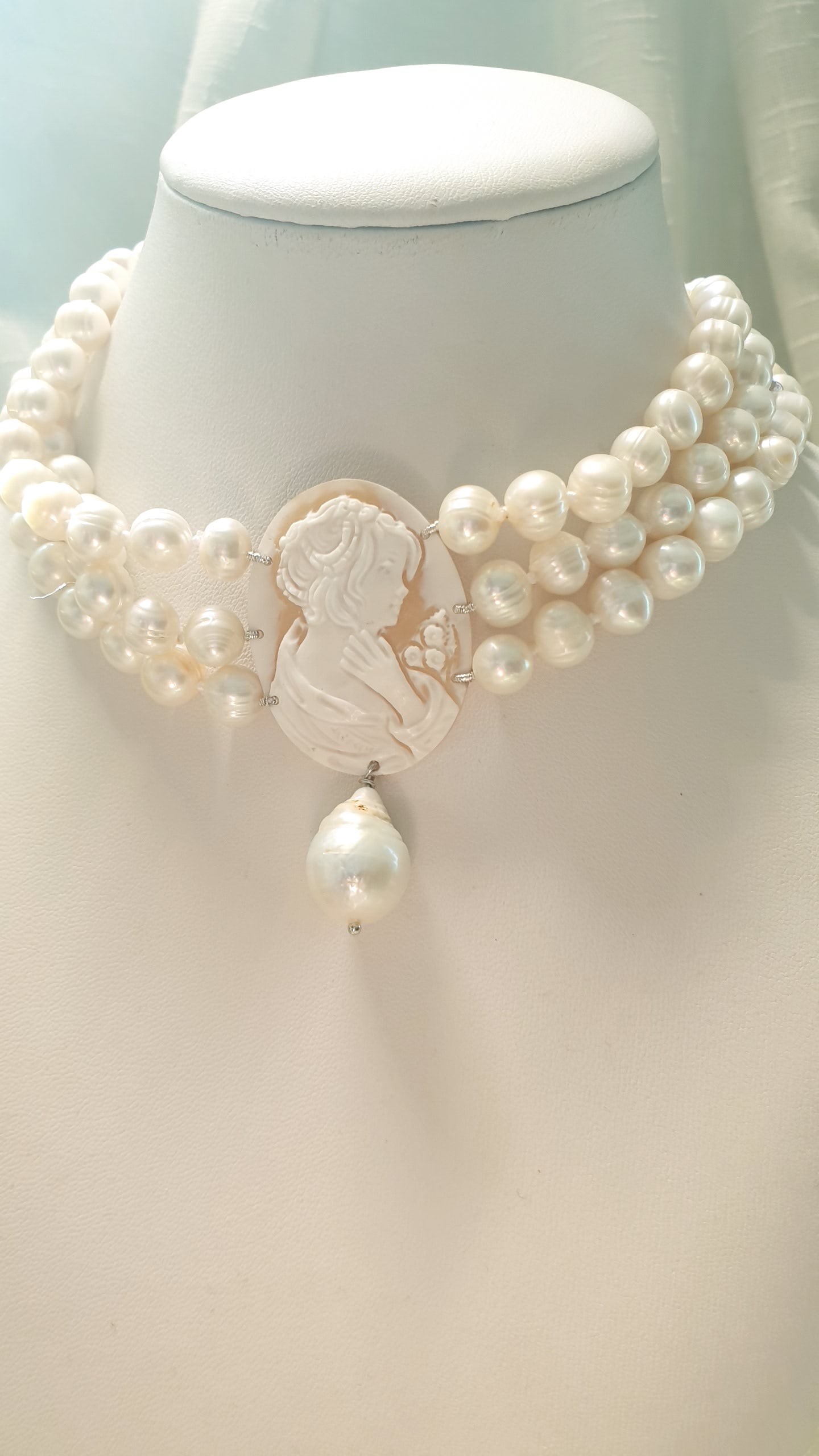 Three-strand pearl choker with engraved cameo and baroque pearl. One of a kind