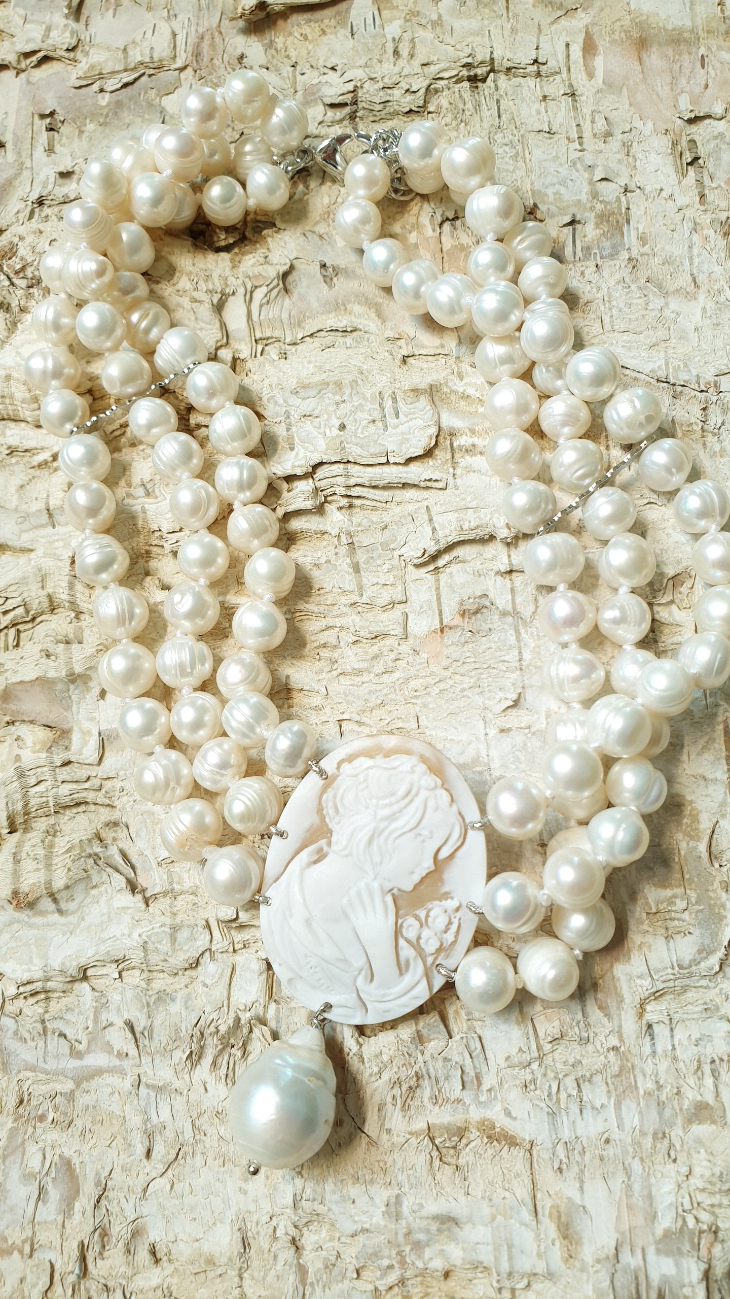 Three-strand pearl choker with engraved cameo and baroque pearl. One of a kind
