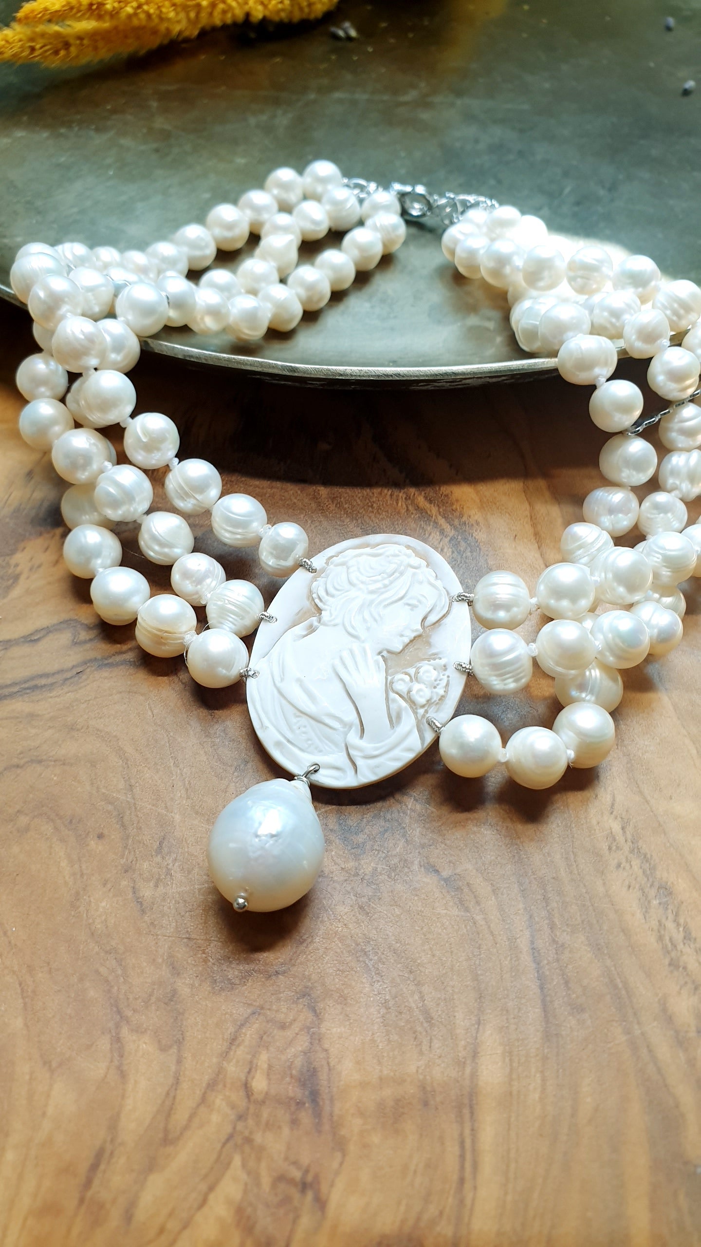 Three-strand pearl choker with engraved cameo and baroque pearl. One of a kind