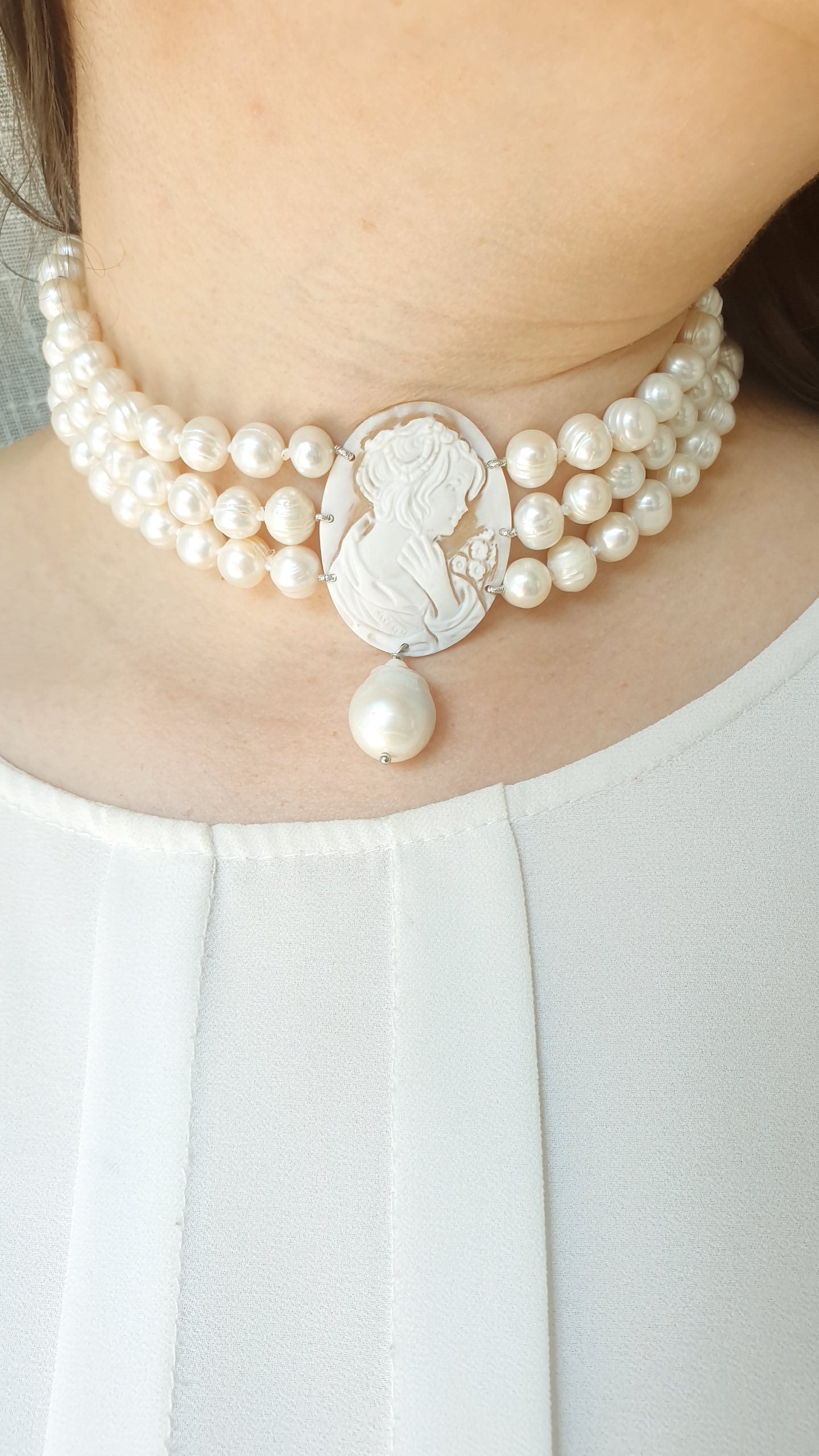 Three-strand pearl choker with engraved cameo and baroque pearl. One of a kind