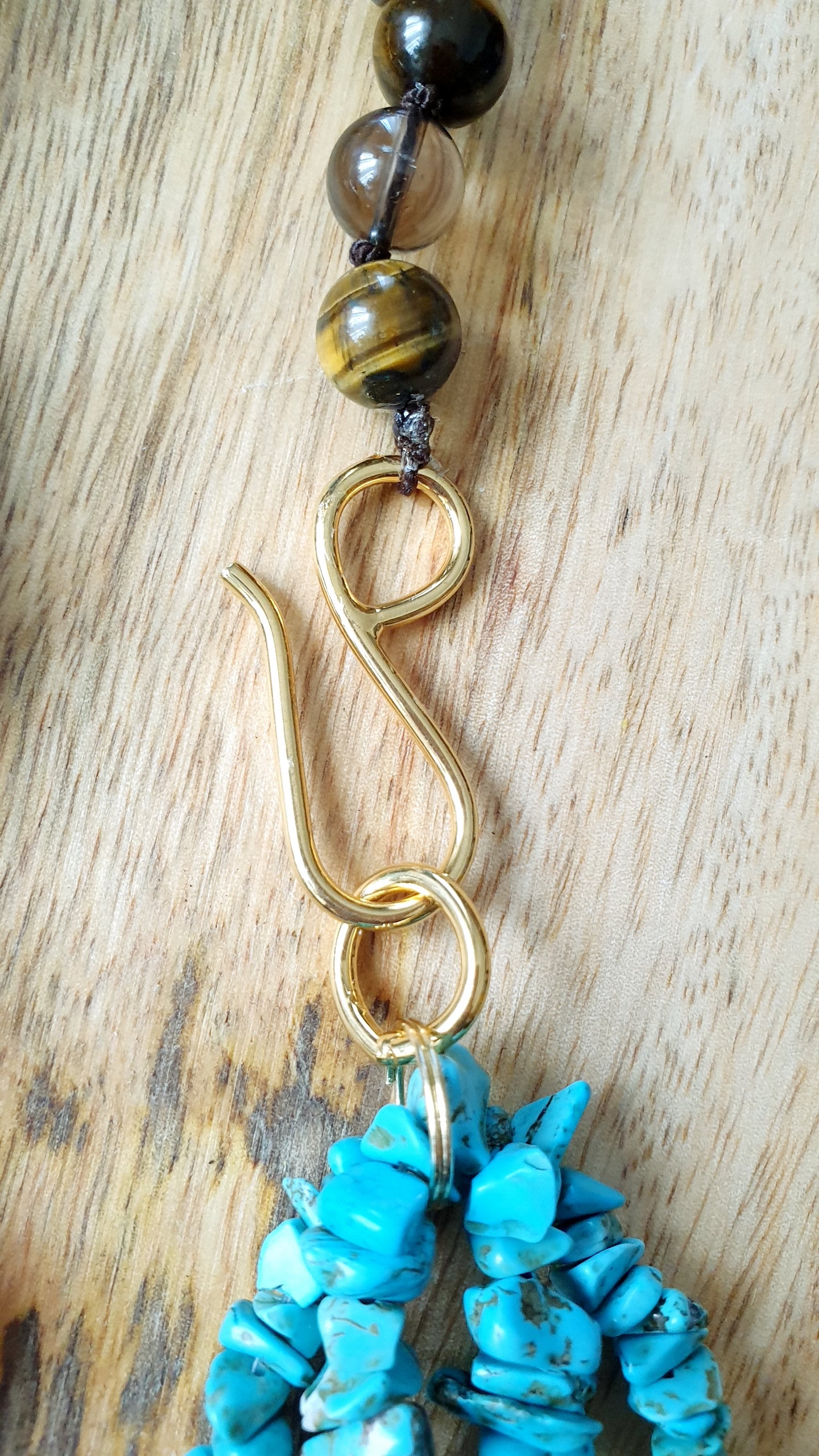 Girocollo con pasta di turchese, ammonite, quarzo fumo, perla, occhio di tigre