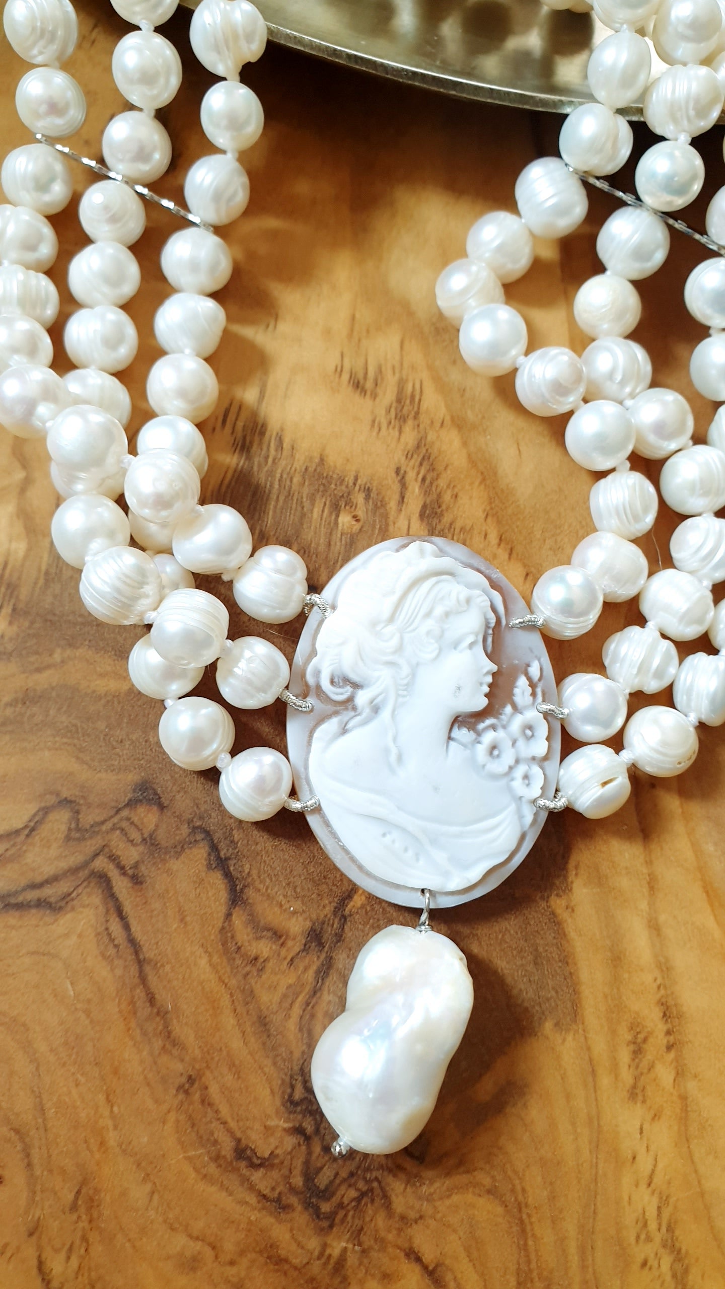 Three-strand pearl choker with engraved cameo and baroque pearl. One of a kind