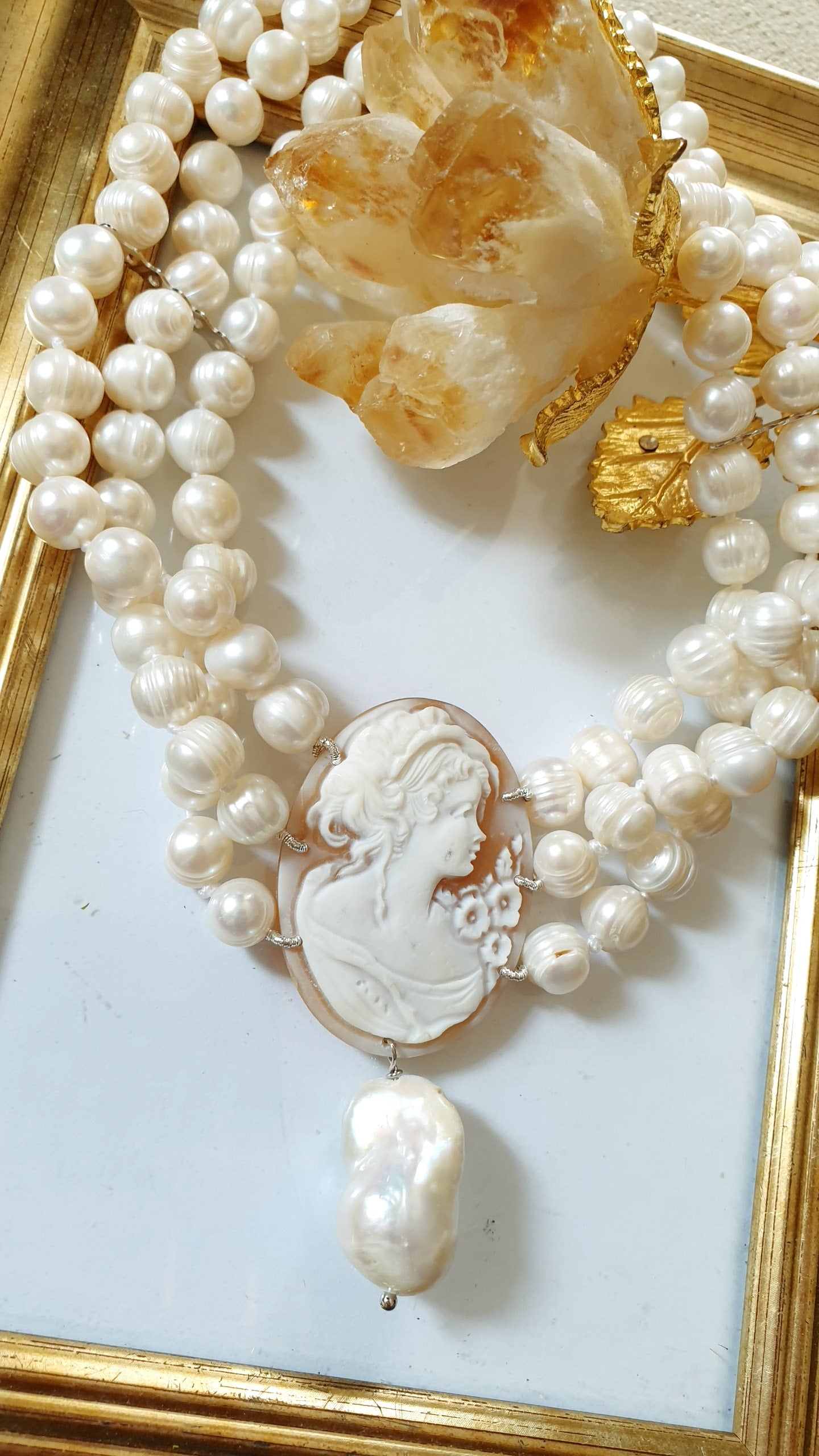 Three-strand pearl choker with engraved cameo and baroque pearl. One of a kind